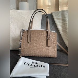 BRAND NWT: Coach Charlie Carryall 28 Inch Signature Leather. Color: Taupe.